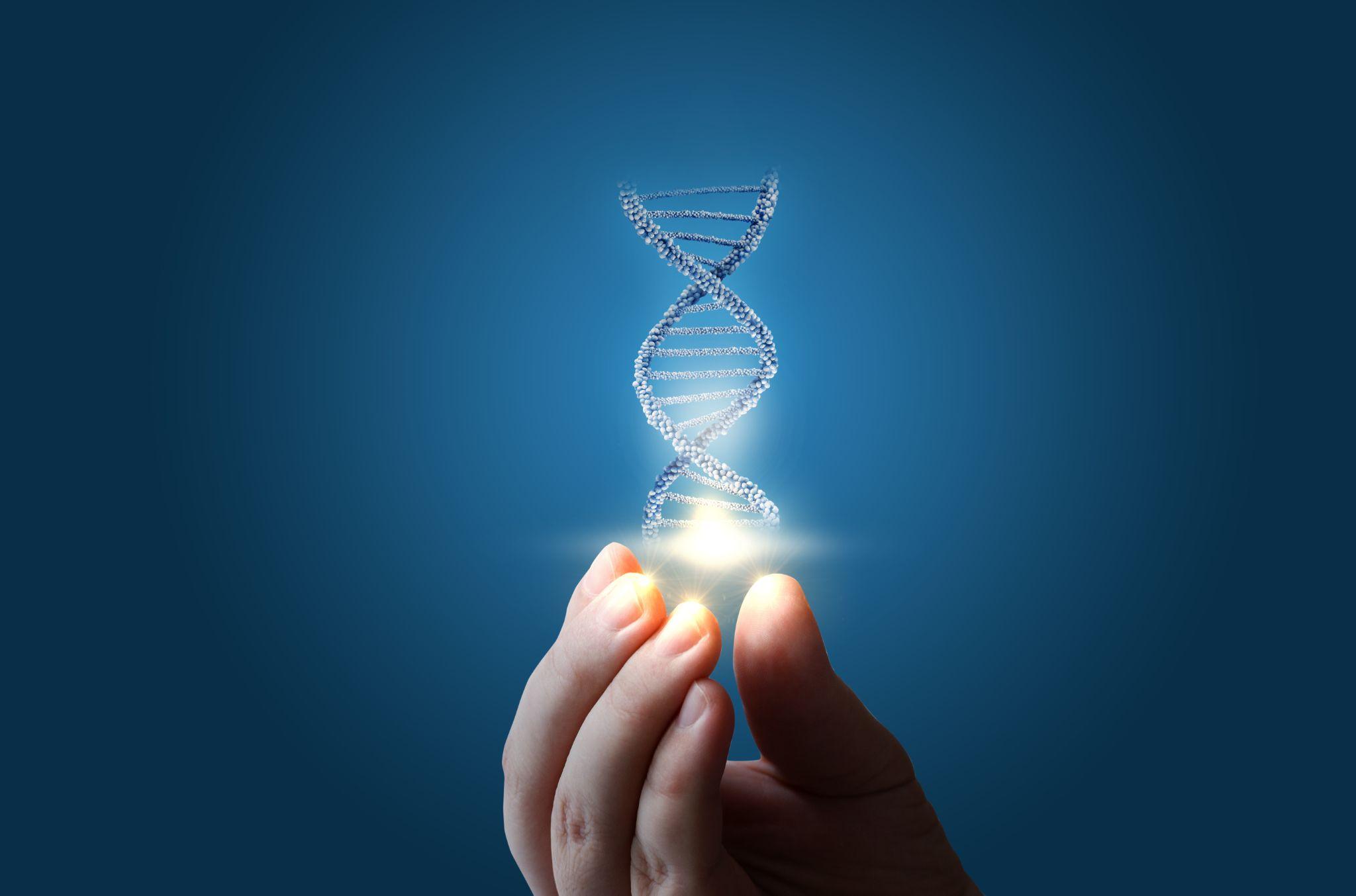 DNA in hand on blue background.