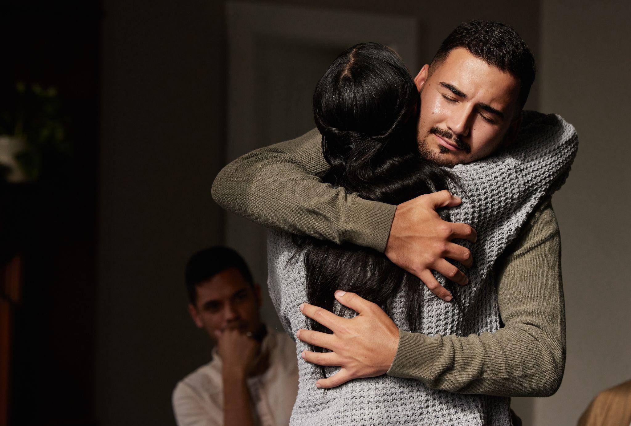 Hug, support and crying man embrace for comfort