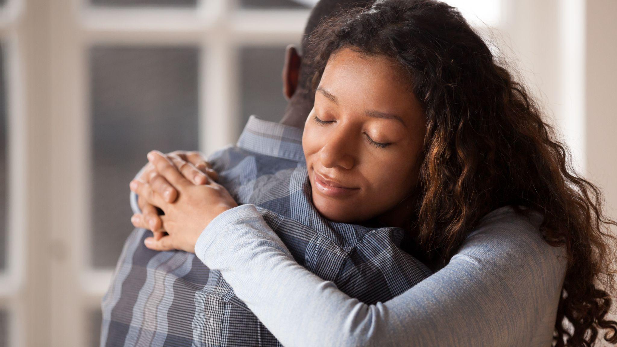 Loving girlfriend hug boyfriend happy to reconcile after fight