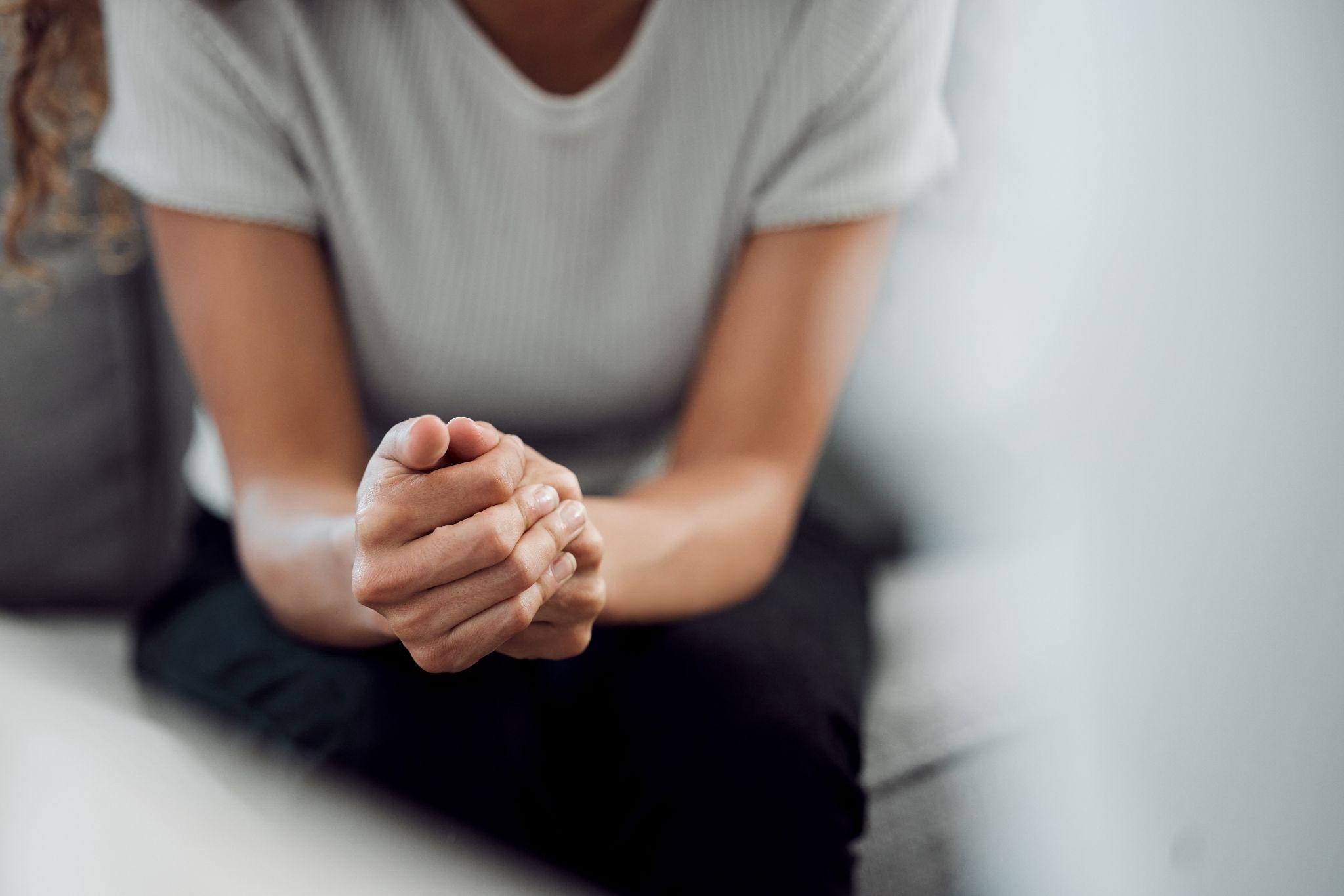 Stress or depression with a female patient feeling nervous in a clinic for support