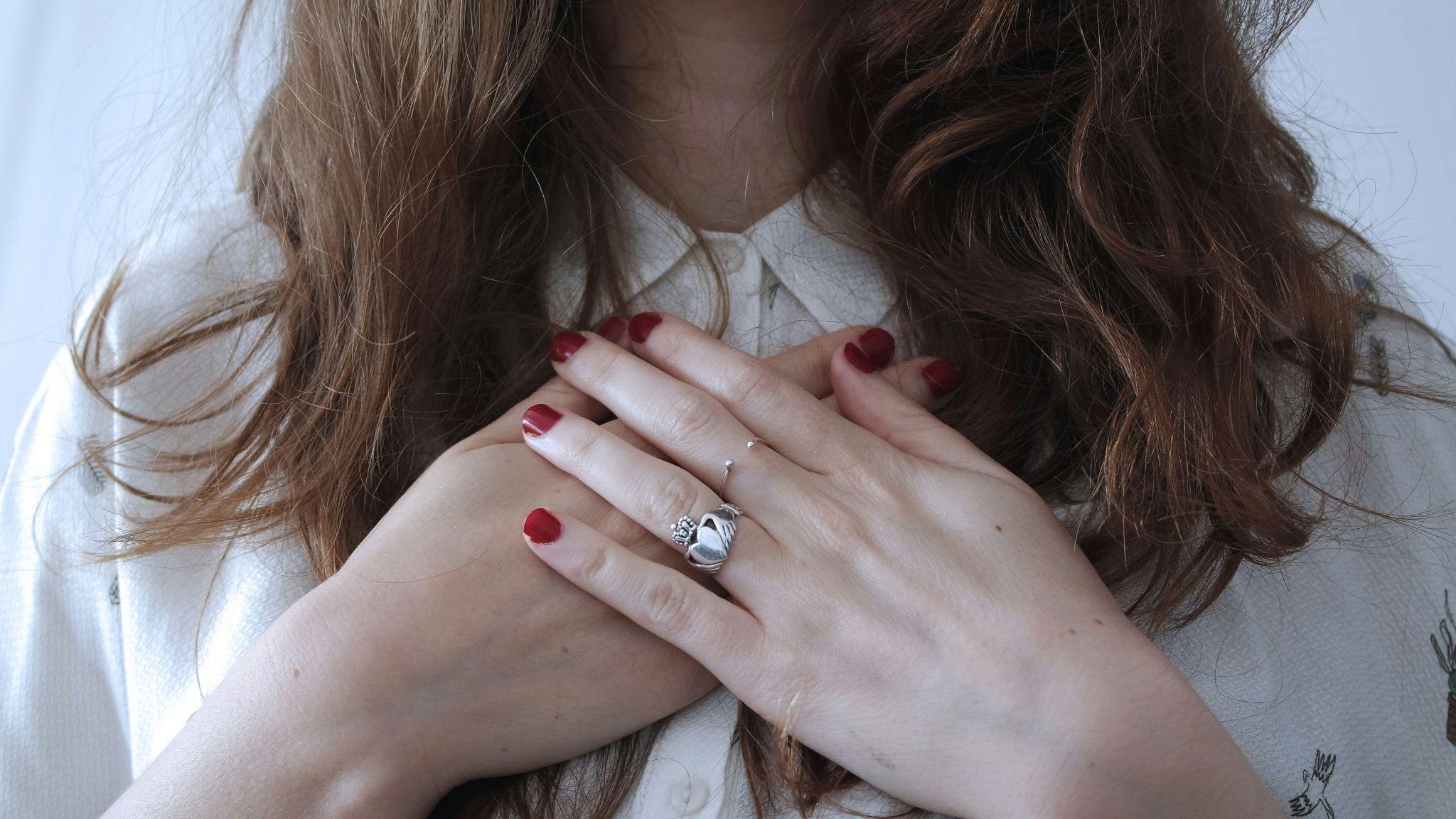 Woman wearing silver colored ring