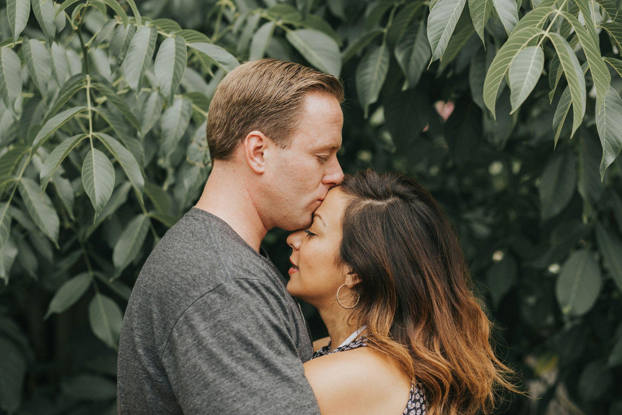 Young happy couple posing in the park