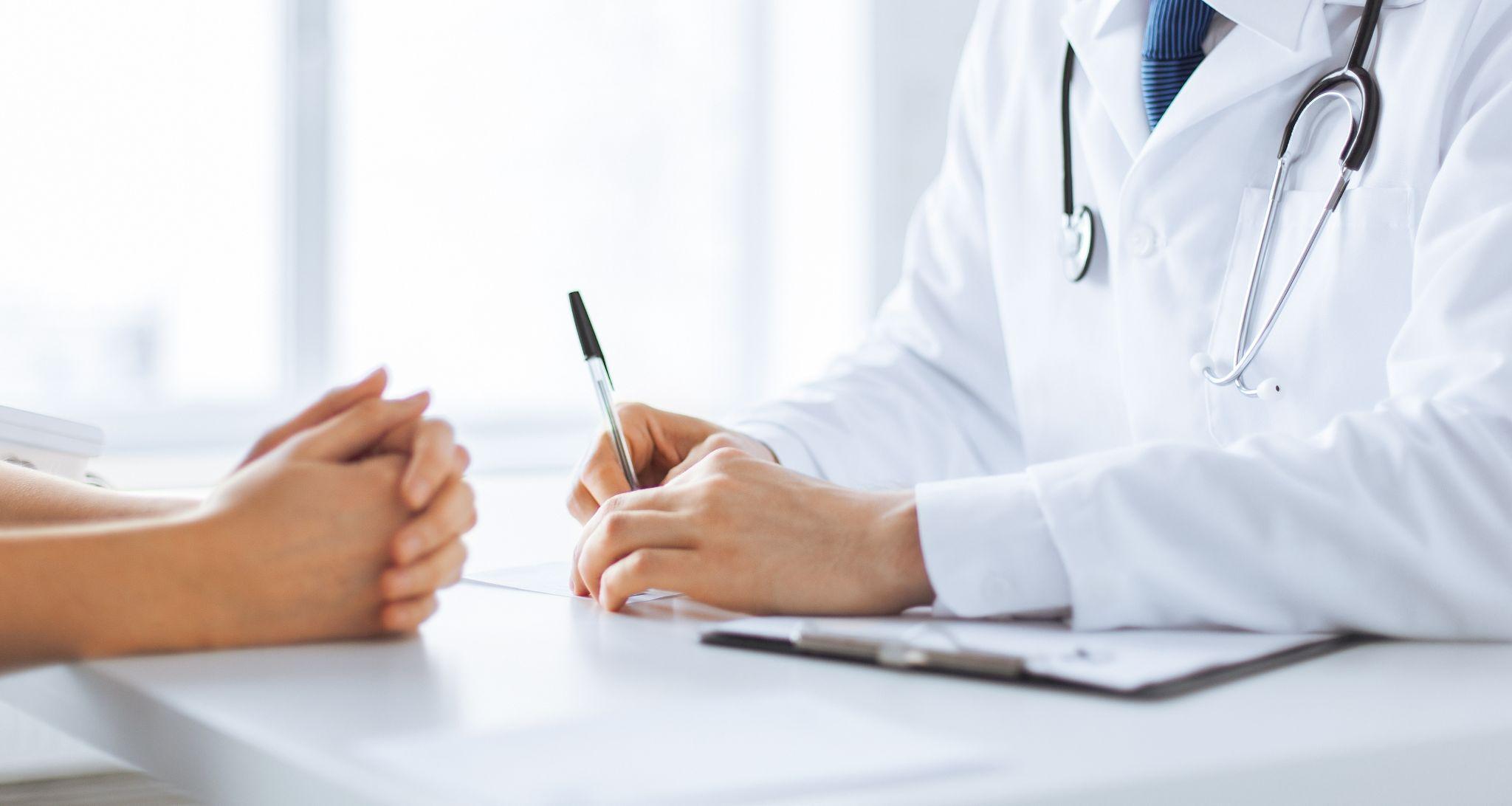 patient and doctor taking notes