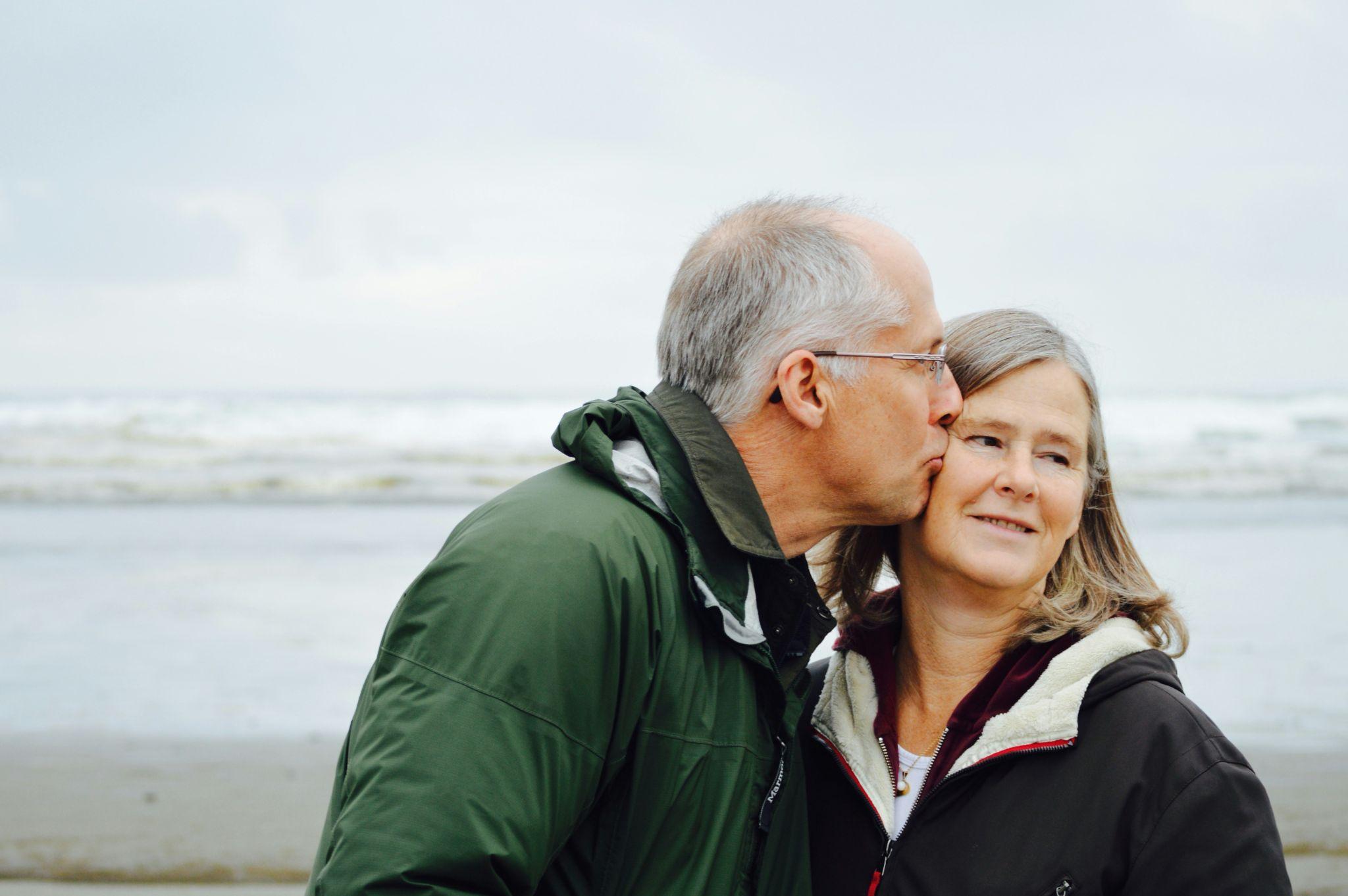 Senior couple relaxing together near the sea