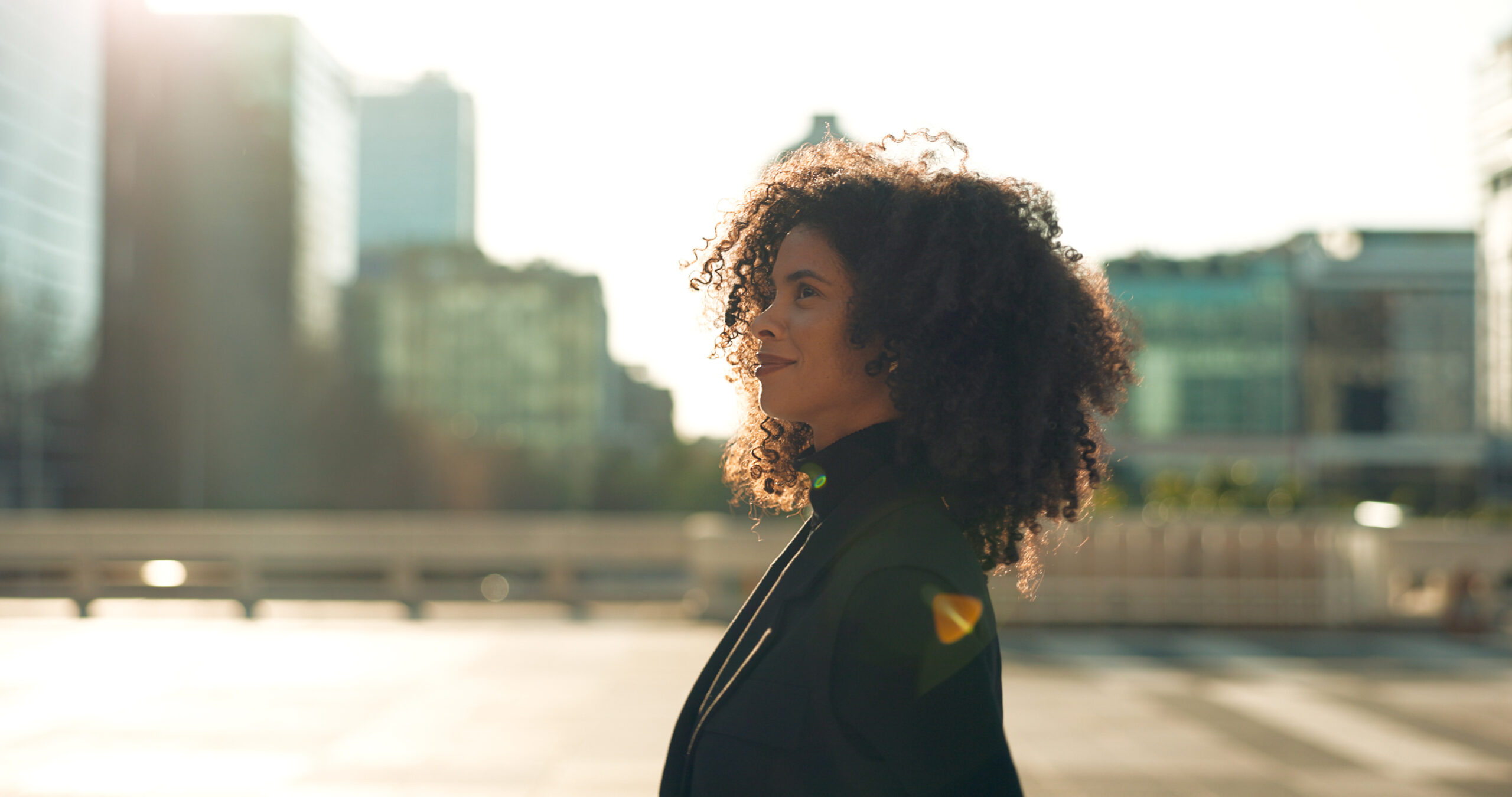 Happy, person with afro and corporate worker moving to work in urban town