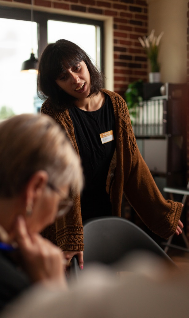 Woman speaking in a group therapy session