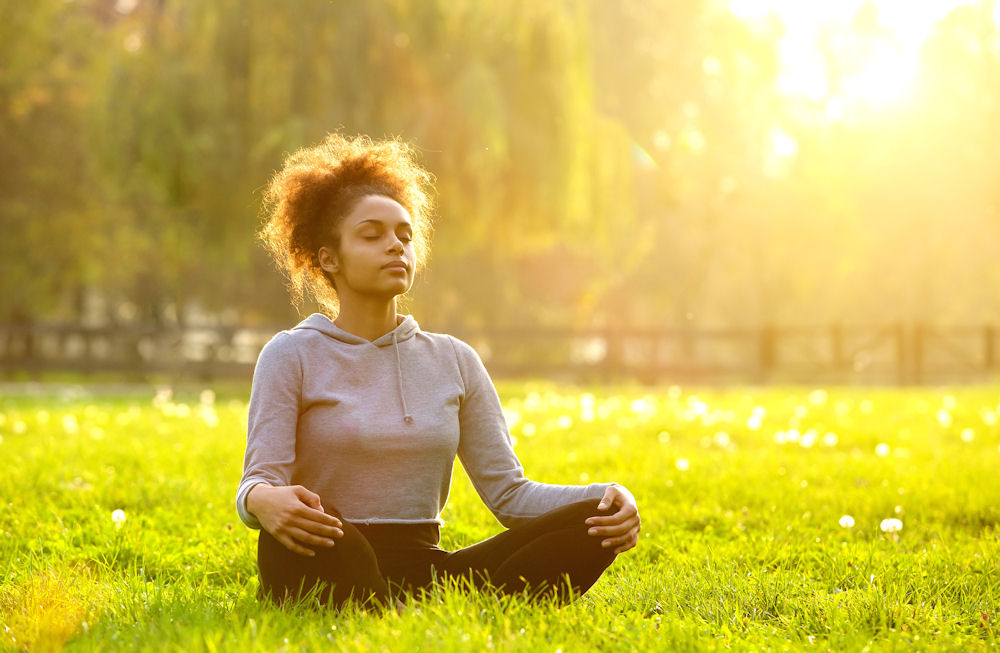 Woman meditating while high on shrooms