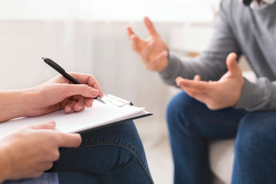 therapist reviewing patient records at Specialized Addiction Services in Simi Valley, California