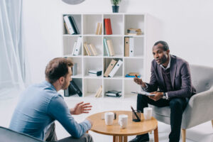 patient discussing addiction recovery with therapist at addiction treatment  center in Redondo Beach, CA